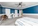 Spacious bedroom with grey carpet and ceiling fan at 2688 Moon Cabin Dr, Powder Springs, GA 30127