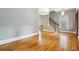 Light-filled dining area with hardwood floors and stairs at 396 15Th Street Nw # 95, Atlanta, GA 30318