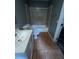Modest bathroom with a tiled shower-tub combination and single sink vanity at 4402 Highland Rd, Decatur, GA 30035