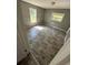 Simple bedroom with light streaming through its two windows illuminating the hardwood floors at 4402 Highland Rd, Decatur, GA 30035