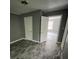 Simple bedroom with light streaming through its window illuminating the hardwood floors at 4402 Highland Rd, Decatur, GA 30035