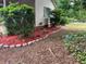 Lush flower bed with stone edging, enhancing the curb appeal of the home at 4402 Highland Rd, Decatur, GA 30035