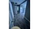 Hallway featuring wood-look floors with doors leading to various rooms in the home at 4402 Highland Rd, Decatur, GA 30035