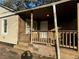Wooden front porch with railing and steps at 4402 Highland Rd, Decatur, GA 30035