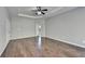 Primary bedroom with hardwood floors and ceiling fan at 490 La Perla Dr, Sugar Hill, GA 30518