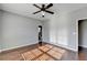 Spacious bedroom with hardwood floors and ceiling fan at 490 La Perla Dr, Sugar Hill, GA 30518