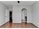 Spacious bedroom with hardwood floors and hallway access at 490 La Perla Dr, Sugar Hill, GA 30518