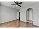 Bedroom with hardwood floors, ceiling fan and ensuite access at 490 La Perla Dr, Sugar Hill, GA 30518