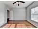 Bedroom with hardwood floors, neutral walls and ceiling fan at 490 La Perla Dr, Sugar Hill, GA 30518