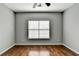 Bright bedroom with hardwood floors and large window at 490 La Perla Dr, Sugar Hill, GA 30518