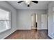 Well-lit bedroom with hardwood floors and ensuite access at 490 La Perla Dr, Sugar Hill, GA 30518