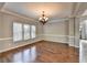 Spacious dining room with hardwood floors and a chandelier at 490 La Perla Dr, Sugar Hill, GA 30518