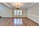 Spacious dining room with hardwood floors and a chandelier at 490 La Perla Dr, Sugar Hill, GA 30518