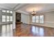 Spacious dining room with hardwood floors and a chandelier at 490 La Perla Dr, Sugar Hill, GA 30518