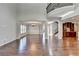 Two-story great room with hardwood floors, kitchen access, and open concept at 490 La Perla Dr, Sugar Hill, GA 30518