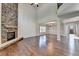 Spacious great room with hardwood floors, stone fireplace, and high ceilings at 490 La Perla Dr, Sugar Hill, GA 30518