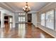 Two-story great room featuring hardwood floors, stone fireplace, and ample natural light at 490 La Perla Dr, Sugar Hill, GA 30518