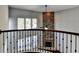 Two-story great room with stone fireplace and balcony overlook at 490 La Perla Dr, Sugar Hill, GA 30518