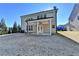 House exterior showcasing covered patio and yard at 490 La Perla Dr, Sugar Hill, GA 30518