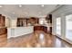Modern kitchen with granite countertops and dark wood cabinets at 490 La Perla Dr, Sugar Hill, GA 30518