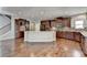 Modern kitchen with granite countertops and dark wood cabinets at 490 La Perla Dr, Sugar Hill, GA 30518