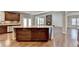 Open concept kitchen with large island and hardwood floors at 490 La Perla Dr, Sugar Hill, GA 30518