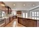 Spacious kitchen with granite countertops and stainless steel appliances at 490 La Perla Dr, Sugar Hill, GA 30518