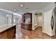 Kitchen features a built-in hutch and hardwood floors at 490 La Perla Dr, Sugar Hill, GA 30518