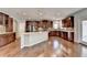 Modern kitchen with granite countertops and dark wood cabinets at 490 La Perla Dr, Sugar Hill, GA 30518