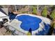 Community pool with blue cover and black fence at 490 La Perla Dr, Sugar Hill, GA 30518