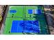 Aerial view of tennis, pickleball, and basketball courts at 490 La Perla Dr, Sugar Hill, GA 30518