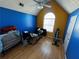 Bright bedroom with hardwood floors and large window at 1224 Labrador Ln, Riverdale, GA 30296