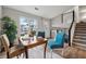 Bright dining area with wooden table and chairs near staircase at 1259 Mill Lake Cir, Stone Mountain, GA 30088