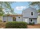 Rear view of house, showcasing a pergola and landscaping at 1259 Mill Lake Cir, Stone Mountain, GA 30088