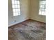 Spacious bedroom with hardwood floors and two windows at 2725 Blount St, East Point, GA 30344