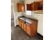 Basic kitchen with wood cabinets and a neutral countertop at 2725 Blount St, East Point, GA 30344