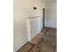 Simple living room featuring a white fireplace and hardwood floors at 2725 Blount St, East Point, GA 30344