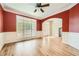 Formal dining room with hardwood floors and red walls at 3580 Bulloch Lake Rd, Loganville, GA 30052