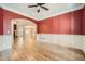 Open dining room with hardwood floors and view to living room at 3580 Bulloch Lake Rd, Loganville, GA 30052