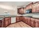 Kitchen with dark wood cabinets, granite countertops, and hardwood floors at 3580 Bulloch Lake Rd, Loganville, GA 30052