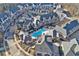 Aerial view of neighborhood showcasing the community pool and landscaping at 6736 Cadence Blvd, Sandy Springs, GA 30328