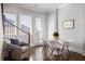 Bright dining area with white chairs and a round table, near the kitchen at 6736 Cadence Blvd, Sandy Springs, GA 30328