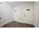 Bright entryway with two white doors and dark hardwood floors at 6736 Cadence Blvd, Sandy Springs, GA 30328