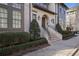 Elegant brick building exterior with manicured landscaping and a welcoming entrance at 6736 Cadence Blvd, Sandy Springs, GA 30328