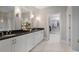 Double vanity bathroom with marble floors and walk-in shower at 6736 Cadence Blvd, Sandy Springs, GA 30328