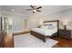 Bright main bedroom with hardwood floors and ensuite bathroom at 6736 Cadence Blvd, Sandy Springs, GA 30328