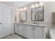 Double vanity bathroom with granite countertops and large mirrors at 1289 State Nw St, Atlanta, GA 30318