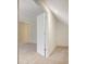 Angled-ceiling attic space featuring a single door at 366 Greycoat Sw Blf, Marietta, GA 30064