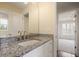 Bathroom vanity with marble countertop, dual sinks, and views to bedroom at 366 Greycoat Sw Blf, Marietta, GA 30064