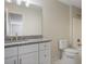 Bathroom featuring granite countertop, white cabinets, toilet, and tiled shower at 366 Greycoat Sw Blf, Marietta, GA 30064